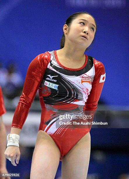 Koko Tsurumi of Japan reacts after falling from the Uneven Bars of the Women's Individual All Around during day seven of the Artistic Gymnastics...