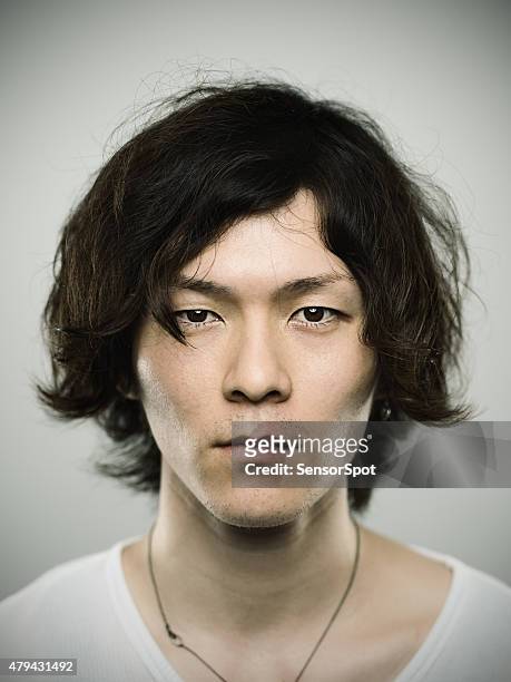 portrait of a young japanese man looking at camera - mug shot stock pictures, royalty-free photos & images