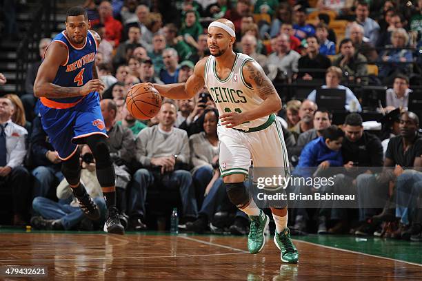 Jerryd Bayless of the Boston Celtics handles the ball against the New York Knicks on March 12, 2014 at the TD Garden in Boston, Massachusetts. NOTE...