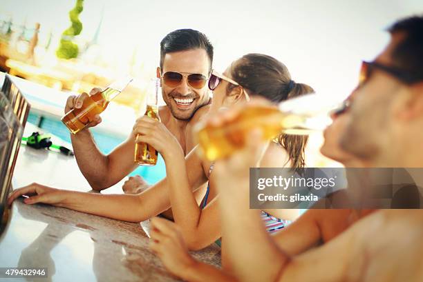 group of friends having fun at beach bar. - beach music stock pictures, royalty-free photos & images