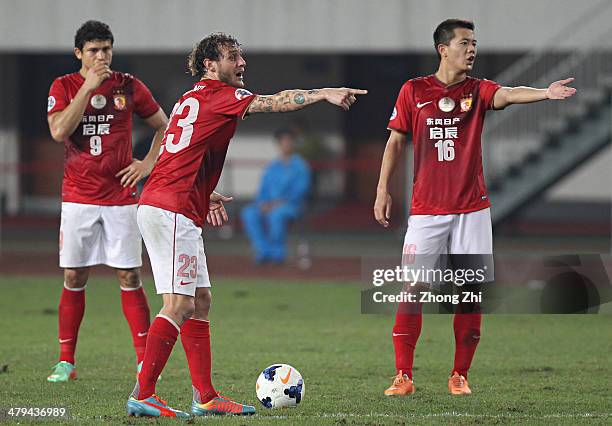 Alessandro Diamanti of Guangzhou Evergrande and his team-mates Elkeson de Oliveira Cardoso and Huang Bowen in action during the Asian Champions...