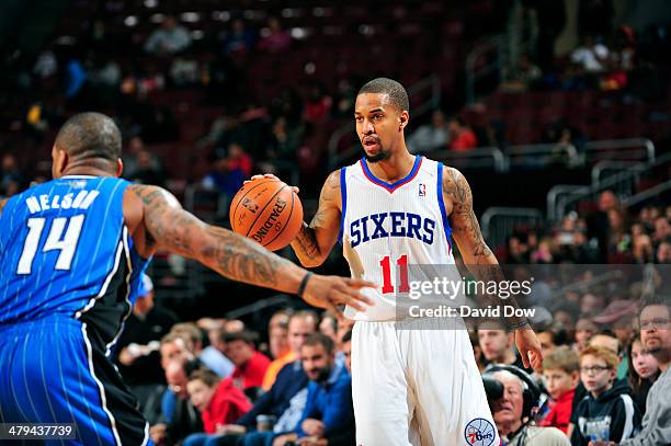 Eric Maynor of the Philadelphia 76ers handles the ball against the Orlando Magic on February 26, 2014 at the Wells Fargo Center in Philadelphia,...