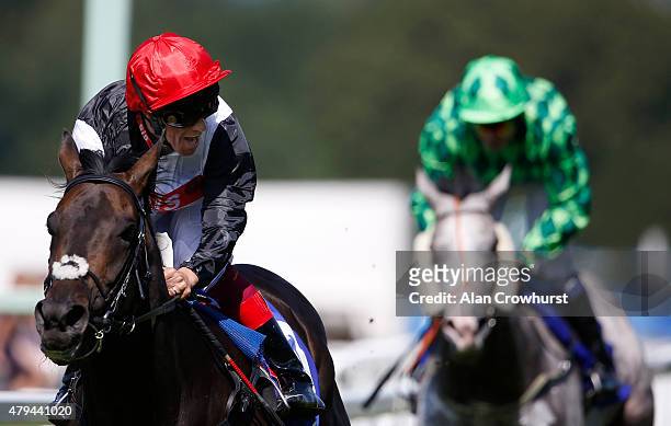 Frankie Dettori riding Golden Horn celebrates winning The Coral - Eclipse at Sandown racecourse on July 04, 2015 in Esher, England.