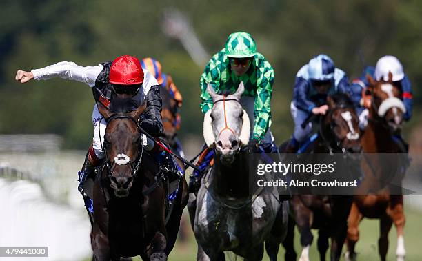 Frankie Dettori riding Golden Horn celebrates winning The Coral - Eclipse at Sandown racecourse on July 04, 2015 in Esher, England.