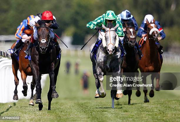 Frankie Dettori riding Golden Horn wins The Coral - Eclipse at Sandown racecourse on July 04, 2015 in Esher, England.