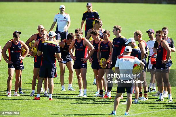Crows coach Brenton Sanderson talks to players during an Adelaide Crows AFL training session at AAMI Stadium on March 19, 2014 in Adelaide, Australia.