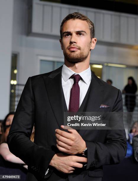 Actor Theo James arrives at the premiere of Summit Entertainment's "Divergent" at the Regency Bruin Theatre on March 18, 2014 in Los Angeles,...