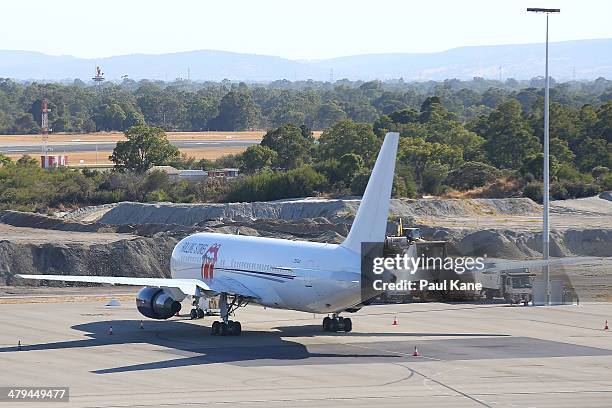 The Aeronexus Corporation - Boeing 767 used by the Rolling Stones is seen parked on the tarmac at Perth international airport on March 19, 2014 in...