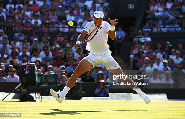 Vasek Pospisil of Canada plays a backhand in his Mens Singles Third Round match against James Ward of Great Britain during day six of the Wimbledon...