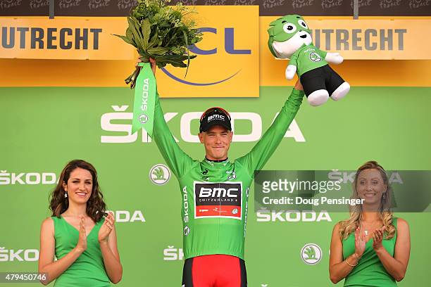 Rohan Dennis of Australia and BMC Racing Team wears the green jersey, denoting the top points scoring rider following his victory during stage one of...