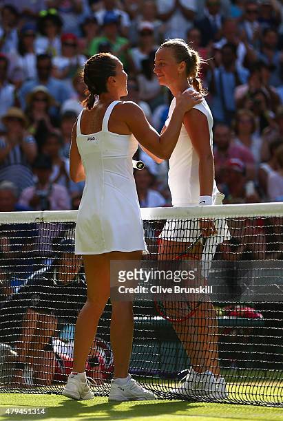 Jelena Jankovic of Serbia consoles Petra Kvitova of Czech Republic after victory in their Ladies Singles third Round match during day six of the...