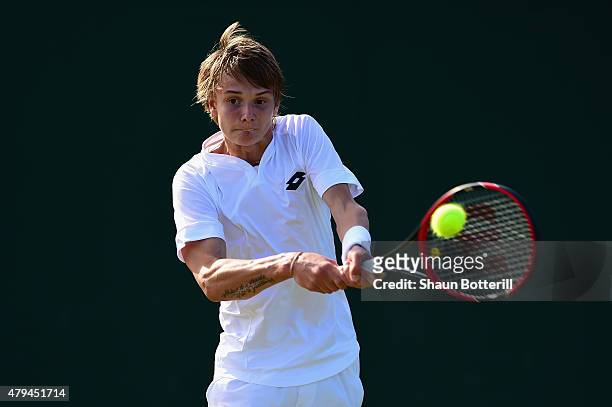 Alexander Bublik of Russia in action during the Boys Singles First Round match against Stefanos Tsitsipas of Greece during day six of the Wimbledon...