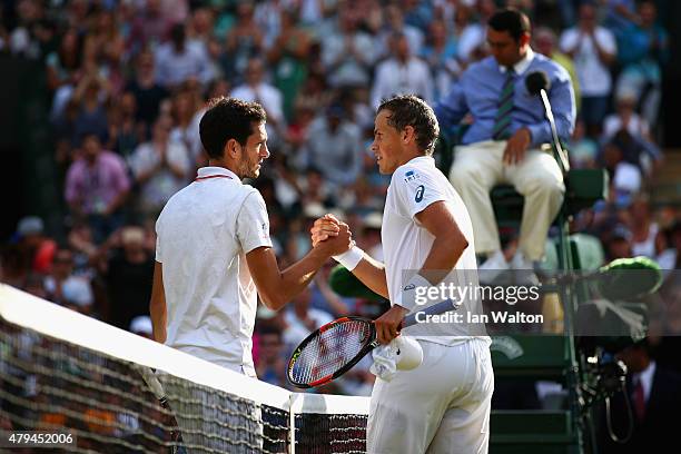 Vasek Pospisil of Canada celebrates at the net after winning his Mens Singles Third Round match against James Ward of Great Britain during day six of...