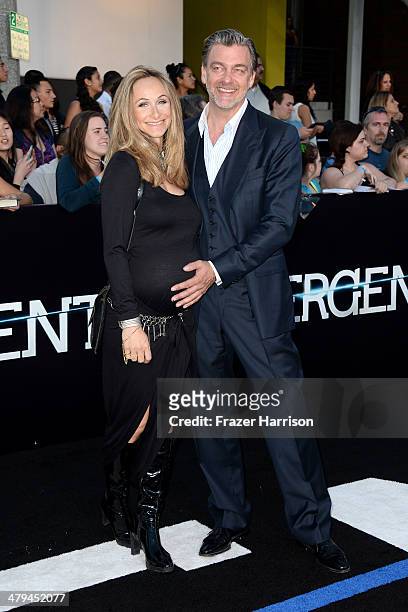 Actor Ray Stevenson and Elisabetta Caraccia arrive at the premiere of Summit Entertainment's "Divergent" at the Regency Bruin Theatre on March 18,...