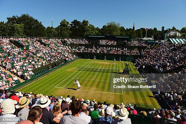 Tomas Berdych of Czech Republic serves in his Mens Singles Third Round match against Pablo Andujar of Spain during day six of the Wimbledon Lawn...