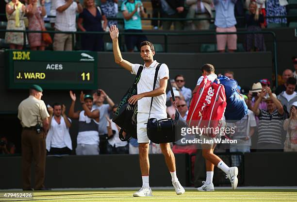 James Ward of Great Britain leaves court one after losing his Mens Singles Third Round match against Vasek Pospisil of Canada during day six of the...