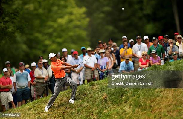 Tiger Woods takes his second shot on the eighth hole during the third round of the Greenbrier Classic at the Old White TPC on July 4, 2015 in White...