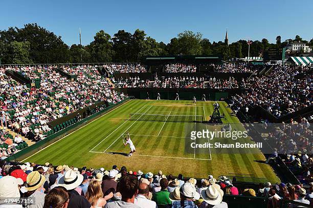 Tomas Berdych of Czech Republic serves in his Mens Singles Third Round match against Pablo Andujar of Spain during day six of the Wimbledon Lawn...
