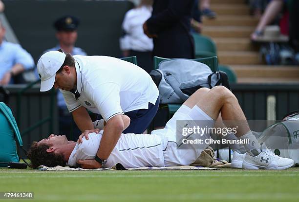 Andy Murray of Great Britain receives treatment to an injury in his Mens Singles Third Round match against Andreas Seppi during day six of the...