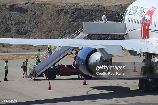 Flight crew are seen boarding the Aeronexus Corporation's - Boeing 767 used by the Rolling Stones for pre-flight checks at Perth international...