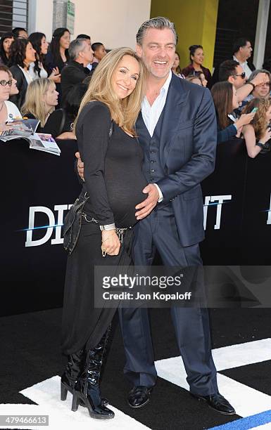 Actor Ray Stevenson and Elisabetta Caraccia arrive at the Los Angeles Premiere "Divergent" at Regency Bruin Theatre on March 18, 2014 in Los Angeles,...