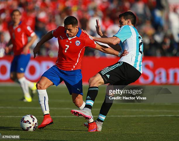 Alexis Sanchez of Chile fights for the ball with Javier Pastore of Argentina during the 2015 Copa America Chile Final match between Chile and...