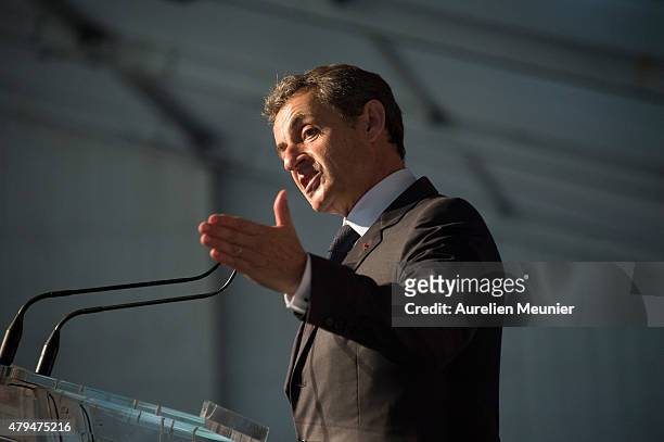 Former French President Nicolas Sarkozy addresses thousands of political supporters during a speech at La Fete de la Violette on July 4, 2015 in La...
