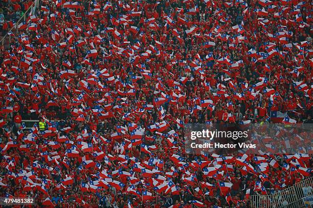 Fans of Chile wave Chilean flags to cheer for their team during the 2015 Copa America Chile Final match between Chile and Argentina at Nacional...