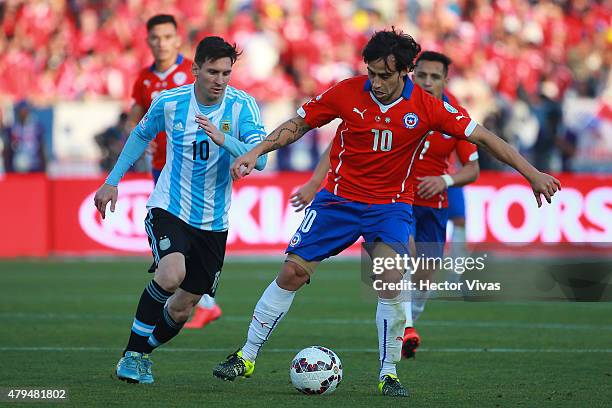 Jorge Valdivia of Chile fights for the ball with Lionel Messi of Argentina during the 2015 Copa America Chile Final match between Chile and Argentina...