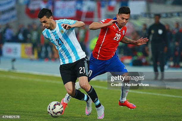 Javier Pastore of Argentina fights for the ball with Charles Aranguiz of Chile during the 2015 Copa America Chile Final match between Chile and...