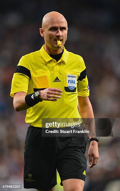 Referee Sergei Karasev looks on during the EEFA Champions League round of 16 second leg match between Real Madrid CF and FC Schalke 04 at Estadio...