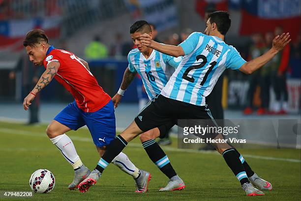 Eduardo Vargas of Chile fights for the ball with Javier Pastore of Argentina during the 2015 Copa America Chile Final match between Chile and...