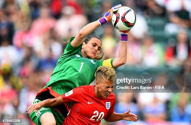 Nadine Angerer of Germany is challenged by Lianne Sanderson of England during the FIFA Women's World Cup 2015 Third Place Play-off match between...