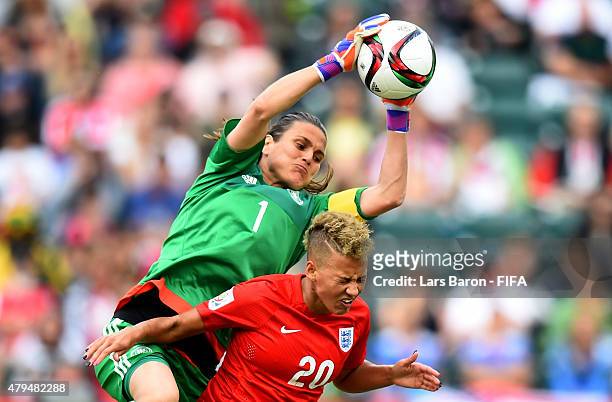 Nadine Angerer of Germany is challenged by Lianne Sanderson of England during the FIFA Women's World Cup 2015 Third Place Play-off match between...