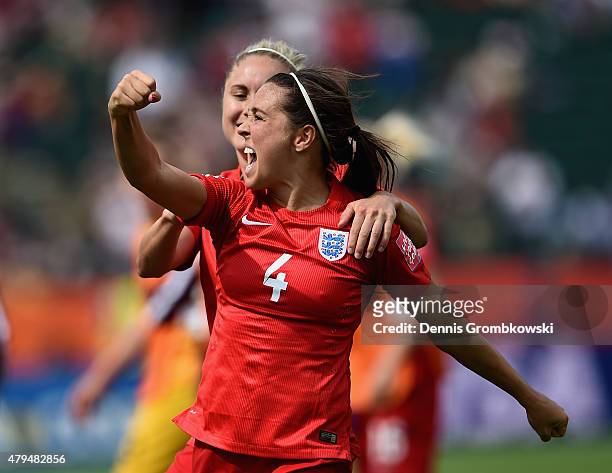 Fara Williams of England celebrates with team mate Steph Houghton as she scores the opening goal from a penalty during the FIFA Women's World Cup...