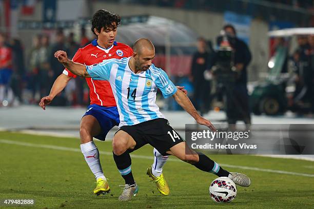 Javier Mascherano of Argentina fights for the ball with Matias Fernandez of Chile during the 2015 Copa America Chile Final match between Chile and...