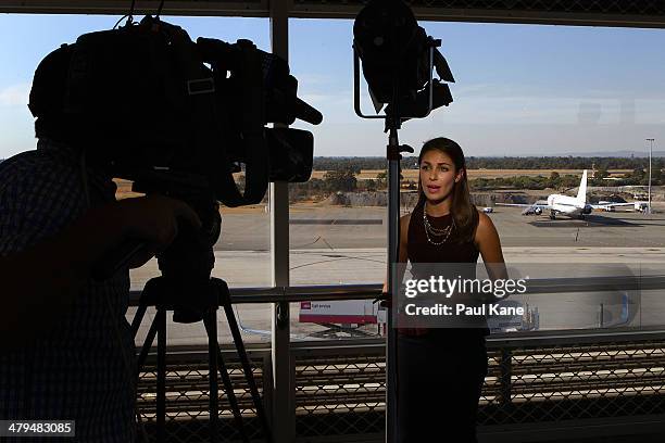News crew perform a live cross as the Aeronexus Corporation's - Boeing 767 used by the Rolling Stones is parked on the tarmac at Perth international...