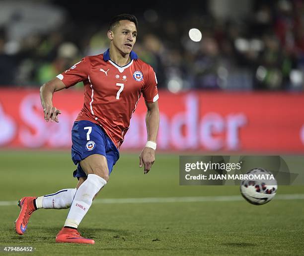 Chile's forward Alexis Sanchez shoots to score against Argentina in a penalty shootout in the 2015 Copa America football championship final, in...