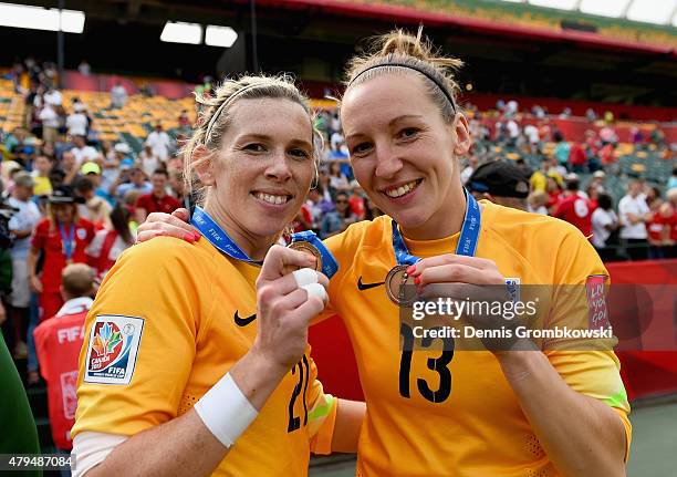 Carly Telford and Siobhan Chamberlain of England celebrate after the FIFA Women's World Cup Canada 2015 Third Place Play-off match between Germany...