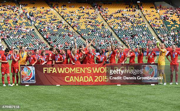 England players celebrate their third place after the FIFA Women's World Cup Canada 2015 Third Place Play-off match between Germany and England at...