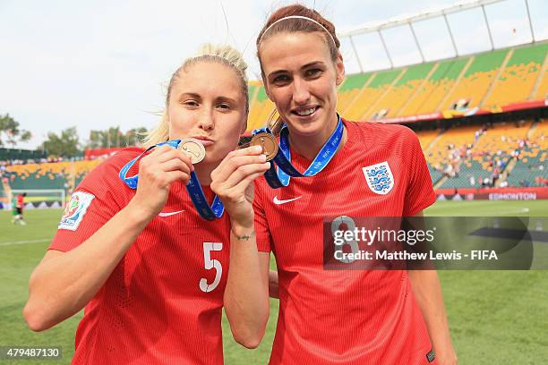 Steph Houghton and Jill Scott of England celebrate their teams third place after defeating Germany during the FIFA Women's World Cup 2015 Third Place...