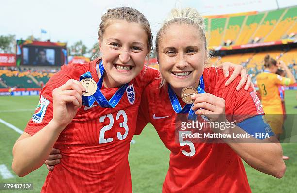 Steph Houghton and Ellen White of England celebrate their teams third place after defeating Germany during the FIFA Women's World Cup 2015 Third...