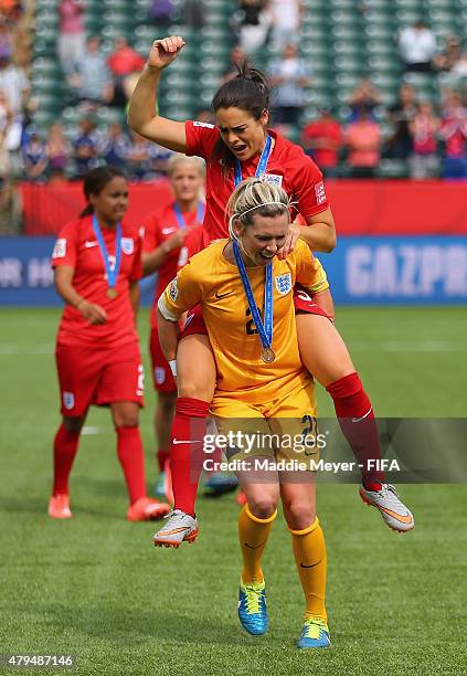 Carly Telford of England and Claire Rafferty celebrate their 1-0 win over Germany in the FIFA Women's World Cup 2015 third place play-off match at...