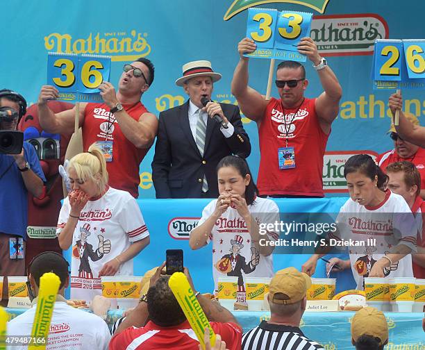 Miki Sudo, George Shea, Sonya Thomas and Juliet Lee attends the 2015 Nathan's Famous 4th Of July International Hot Dog Eating Contest at Coney Island...