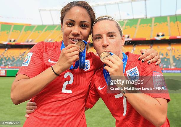 Alex Scott and Jordan Nobbs of England celebrate their teams third place after defeating Germany during the FIFA Women's World Cup 2015 Third Place...