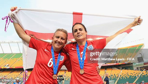 Laura Bassett and Claire Rafferty of England celebrate their teams third place after defeating Germany during the FIFA Women's World Cup 2015 Third...