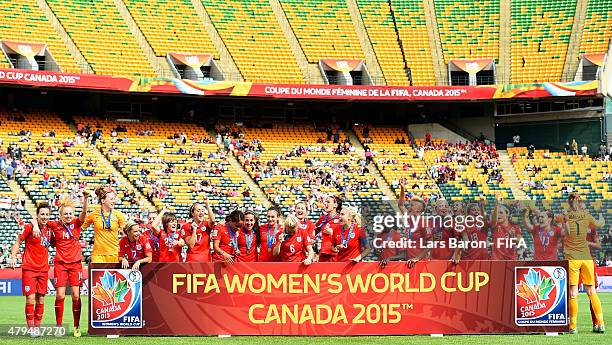 Players of England celebrate after winning the FIFA Women's World Cup 2015 Third Place Play-off match between Germany and England at Commonwealth...