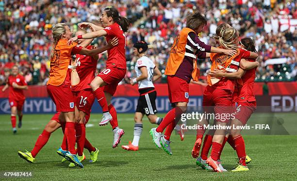 England players celebrate Fara Willaims' penalty kick during the FIFA Women's World Cup 2015 Third Place Play-off match between Germany and England...