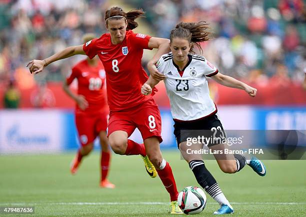 Jill Scott of England challenges Sara Daebritz of Germany during the FIFA Women's World Cup 2015 Third Place Play-off match between Germany and...