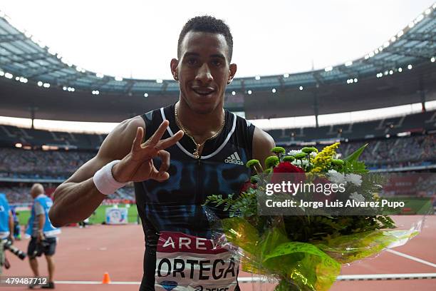 Orlando Ortega of Cuba poses for a picture after setting a 12s94 SB in the Mens 110m Hurdles during the Meeting Areva - IAAF Diamond League at Stade...